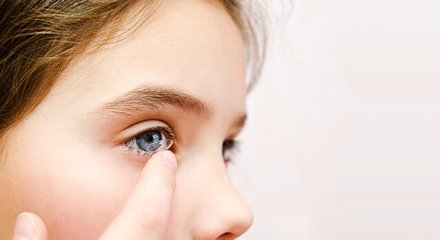 Little Girl Putting Contact in eye.jpg